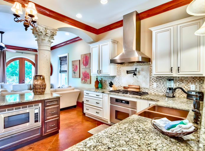 1st Floor - 🍽️ Gourmet Kitchen: Granite counters, premium appliances, and custom copper sinks