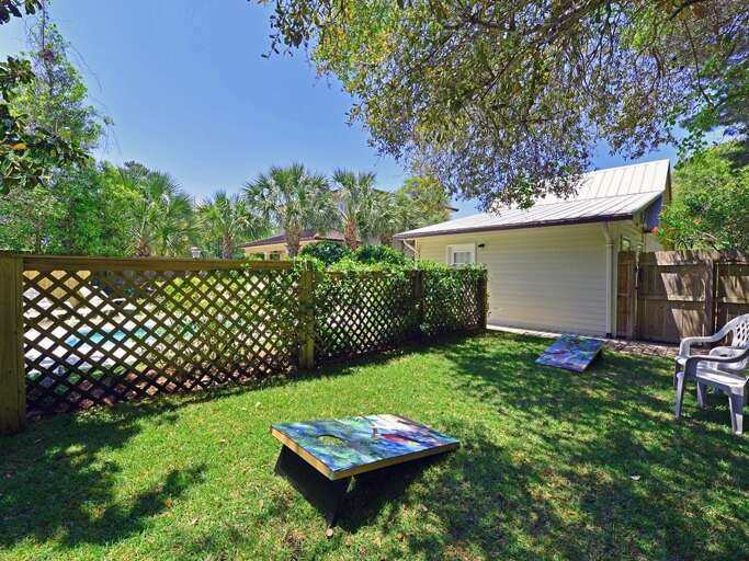 Enjoy a drink and play some Cornhole in the  huge semi-shaded backyard