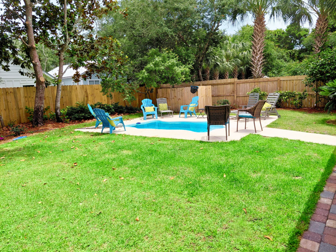 Relaxing fenced outdoor setting for gatherings with Pool, Tiki Bar & Grill!