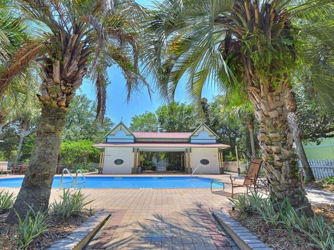 Tropical Poolside Vacation Rental Surrounded By Palm Trees
