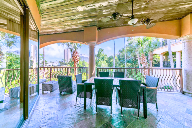 2nd Floor - Large furnished balcony with gas grill and views of the tropical lagoon