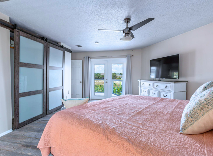 2nd Floor - King Bedroom W/ ensuite bath, balcony w/ serene water views.