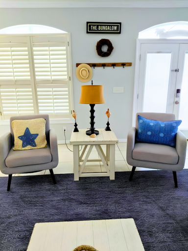 Open Living Area: Cozy seating with a smart TV and coastal decor.