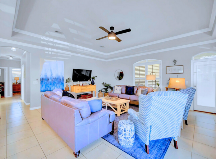 Open Living Area: Cozy seating with a smart TV and coastal decor.