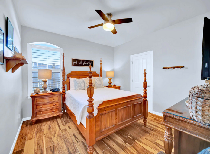 Queen Bedroom: Comfortable queen bed with ceiling fan and ample storage (sleeps 2).