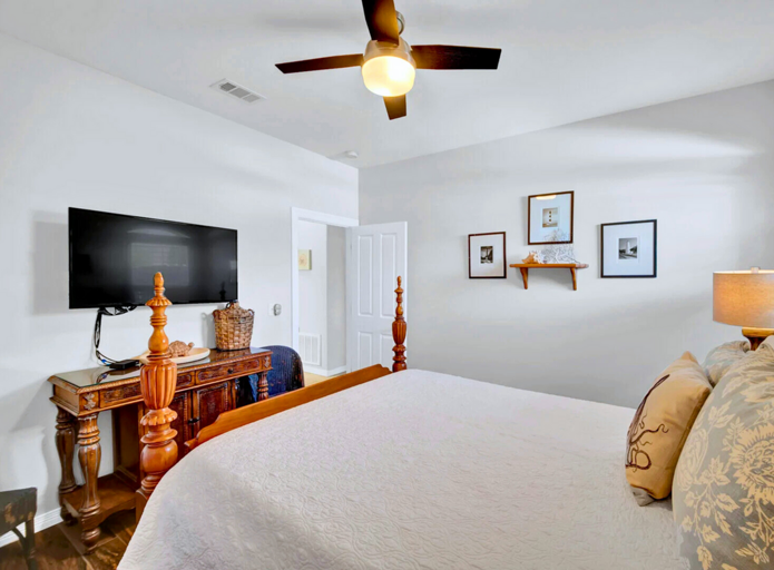 Queen Bedroom: Comfortable queen bed with ceiling fan and ample storage (sleeps 2).