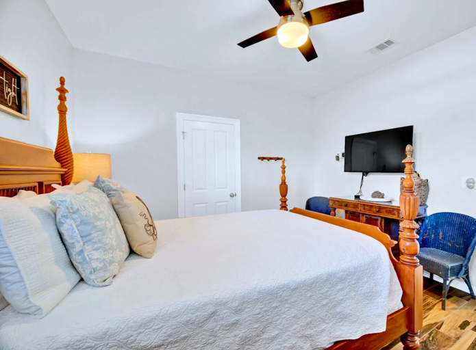Queen Bedroom: Comfortable queen bed with ceiling fan and ample storage (sleeps 2).
