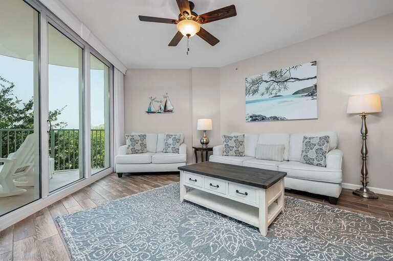 Interior Living Space With Furniture And Balcony Access