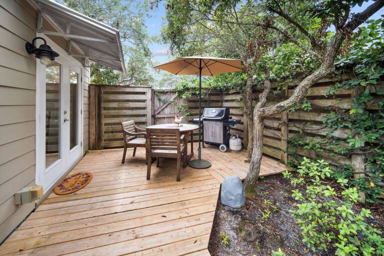 Backyard Deck With Table, Chairs, And Grill