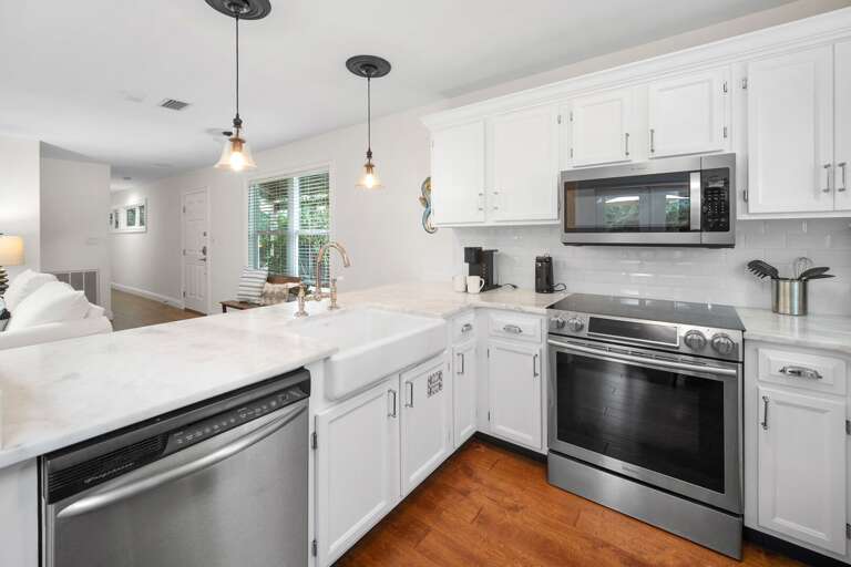 White Kitchen Interior With Stainless Steel Appliances