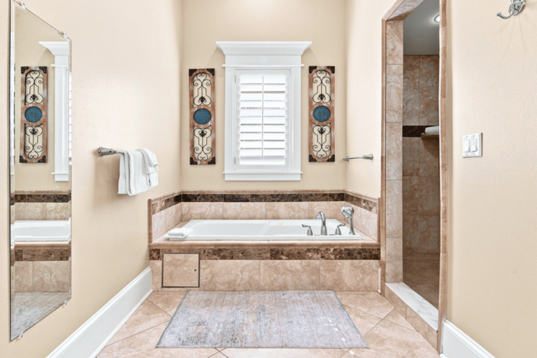 2nd Floor King Suite Bathroom w/ Jacuzzi tub and shower for ultimate relaxation.