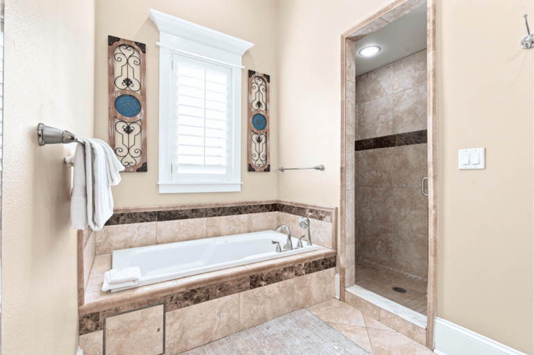 2nd Floor King Suite Bathroom w/ Jacuzzi tub and shower for ultimate relaxation.
