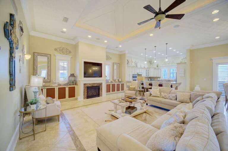 Spacious Living Room Interior With Beige Sofa And Fireplace