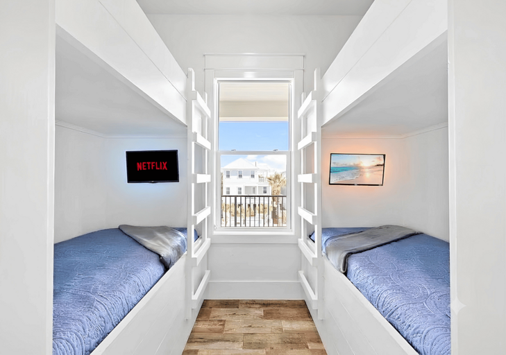 3rd floor oceanic Bedroom #9 has 2 Twin/Twin bunks with mounted flat-screen TVs.