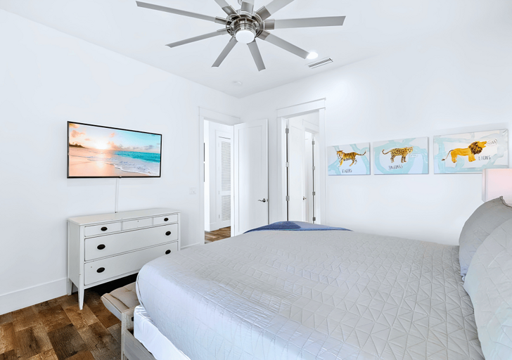 Bedroom #5 also has a mounted flat-screen TV.