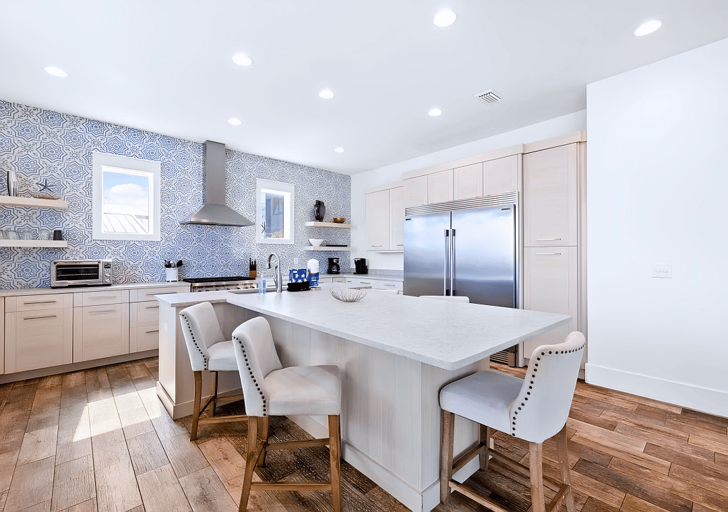 This kitchen comes equipped with many appliances for a variety of cooking needs.