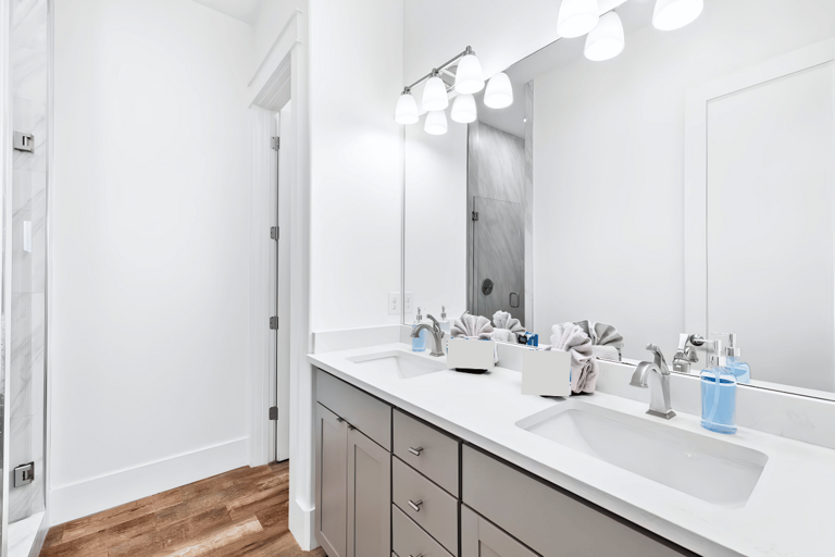 Private Bathroom #6 has a double vanity and walk-in shower for Bedroom #6.