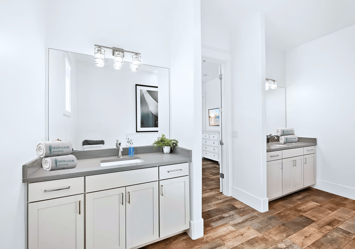 Private Bathroom #7 has a double vanity, walk-in shower, and bathtub for Bedroom #7.