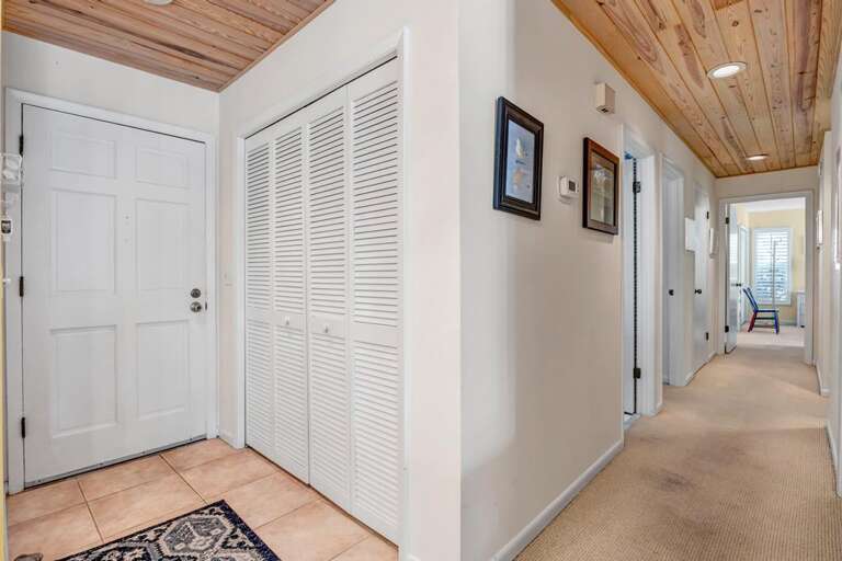 Brightly Lit Indoor Hallway Leading To A Sunlit Space
