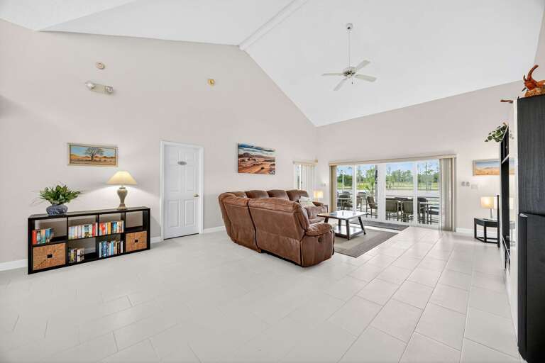 Spacious Living Room Leading To Sunlit Sliding Doors