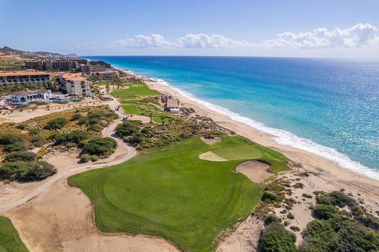 Aerial View Of Coastal Golf Course Near Beach And Ocean Aerial View Of Coastal Golf Course Near Beach And Ocean