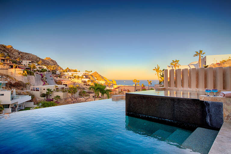 Infinity Pool With Ocean View At Sunset Infinity Pool With Ocean View At Sunset