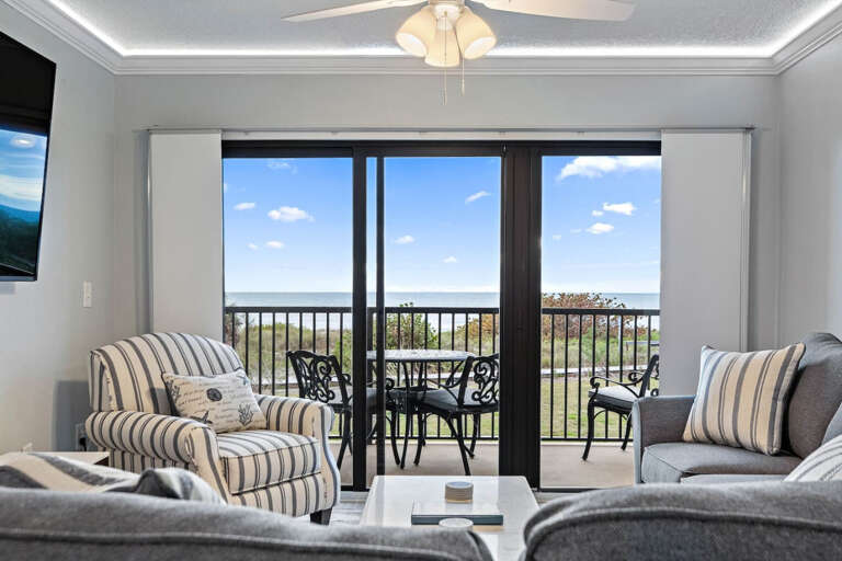 Living Room with beach front balcony Living Room with beach front balcony