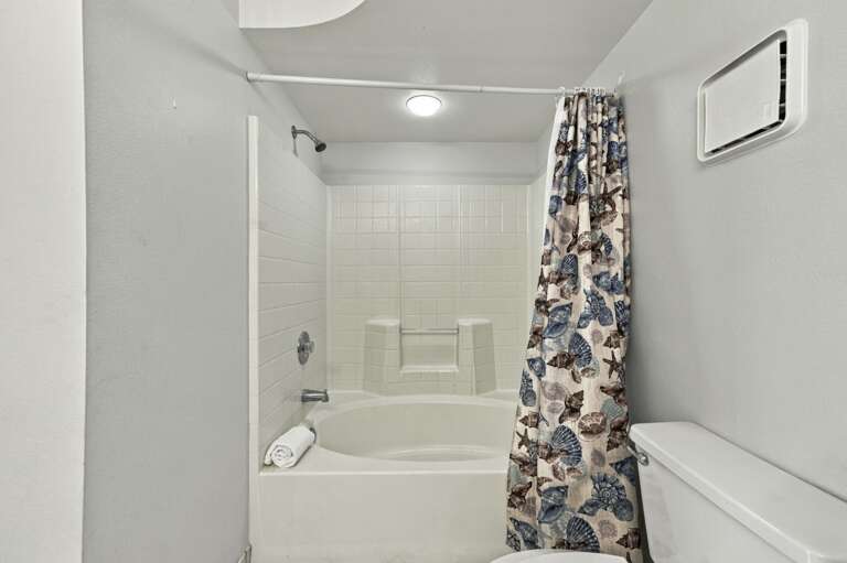 Primary bathroom with convenient tub and shower combination.jpg