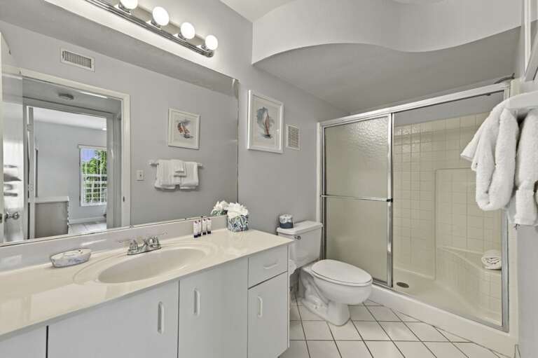 Spacious guest bathroom with large vanity and walk-in shower.jpg