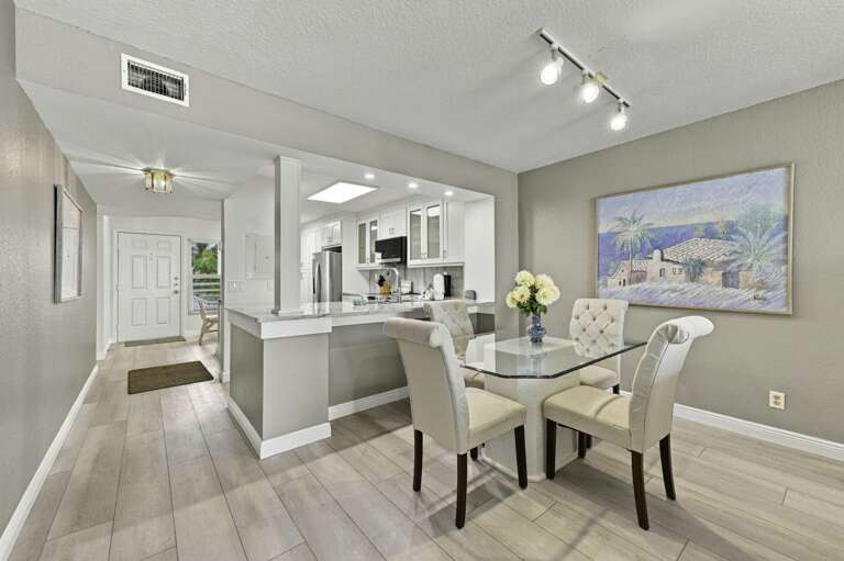 Bright dining area conveniently located between the kitchen and living room.jpg