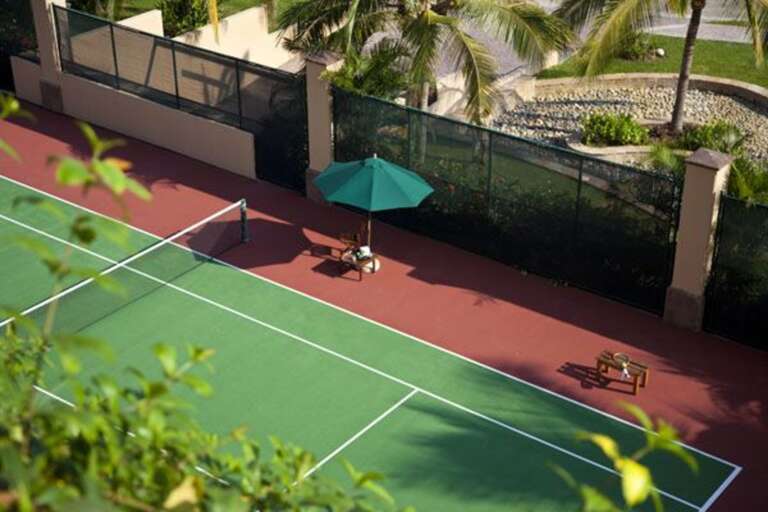 One of multiple  tennis courts on the premises