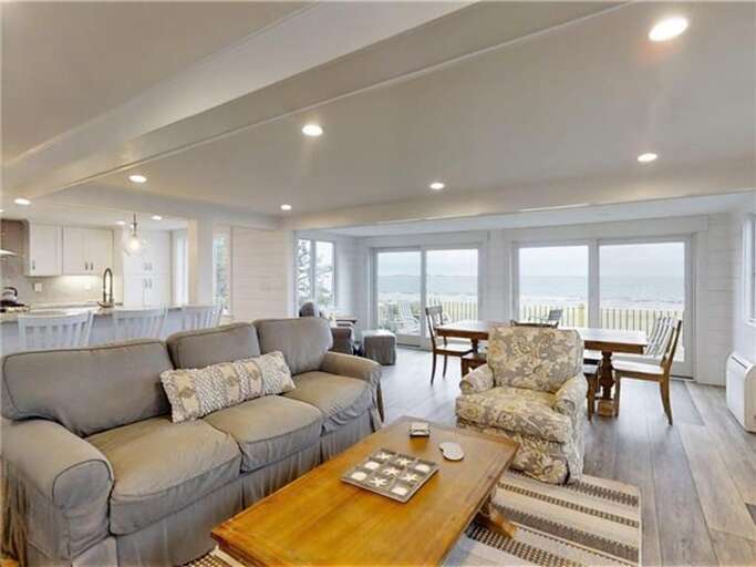 Spacious Seaside Living Space With Soft Sofas And Sweeping Sea Views