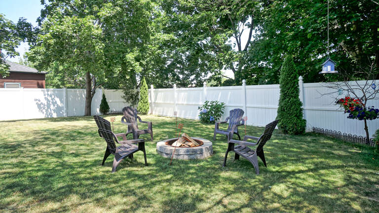 Backyard | Fire pit for guest use | BYOW (bring your own wood) Backyard | Fire pit for guest use | BYOW (bring your own wood)