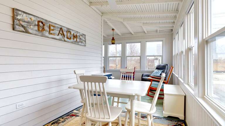 Enter your vacation rental through the beautiful sunroom Enter your vacation rental through the beautiful sunroom