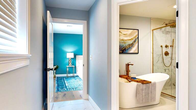 Free standing bathtub and standing shower off primary suite 