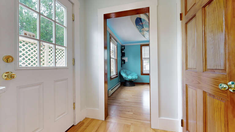 Door leading to back deck | Located off Kitchen | Living Straight Ahead