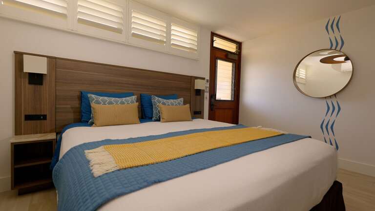 Bedside tables with Taj Majal quartzite, 2 USB chargers, 2 outlets & sconce light switches.