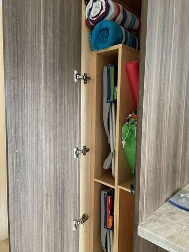 Custom closets efficiently store beach accessories.