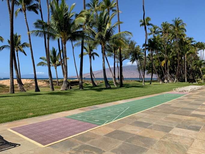 Enjoy a game of shuffleboard or relax on one of many lounge chairs.