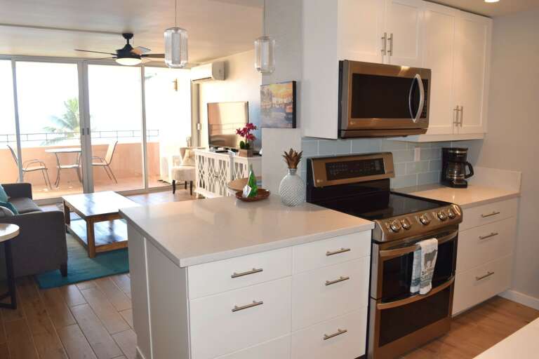 Kitchen opens into living area