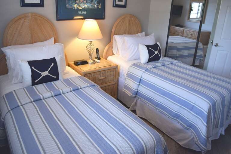 Bright guest bedroom with extra closet storage