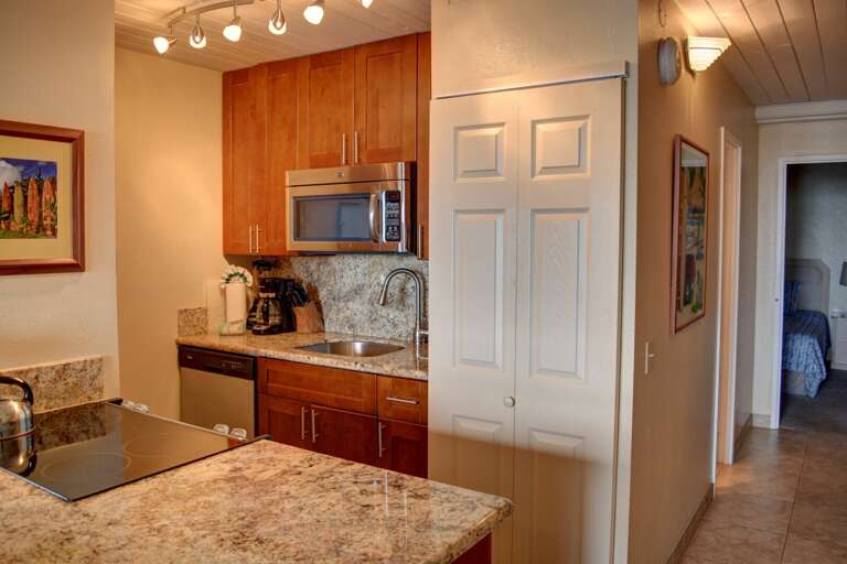 Fully-equipped kitchen with granite countertops