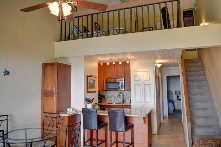 Kitchen and stairway connecting the loft