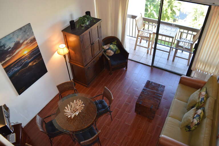 View of dining and living area from upstairs loft