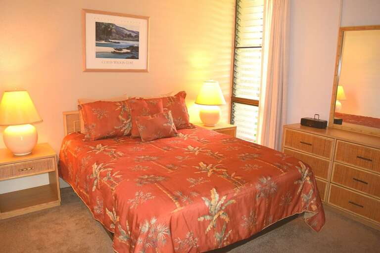 Bedroom with dresser and closet