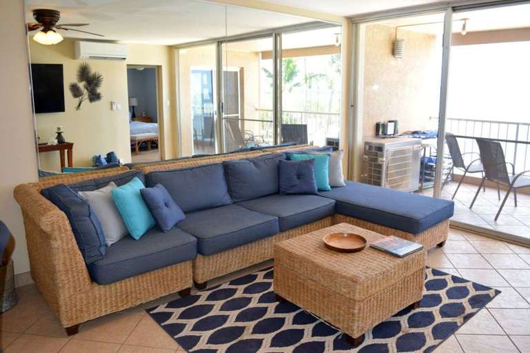 Naturally lit living area with comfortable sofa