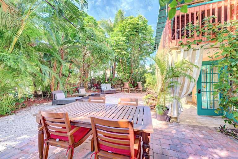 Dining and lounging on garden patio (shared), Siesta Key Village 3BR