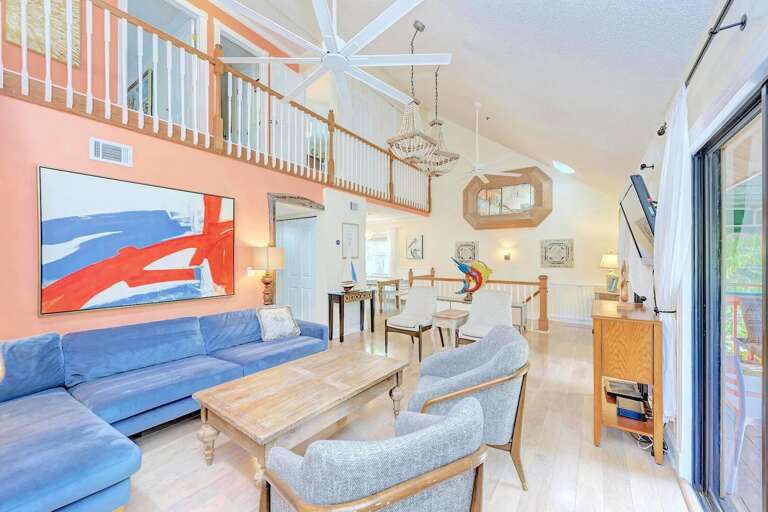 Larger living area opens to balcony, Siesta Key Village 3BR