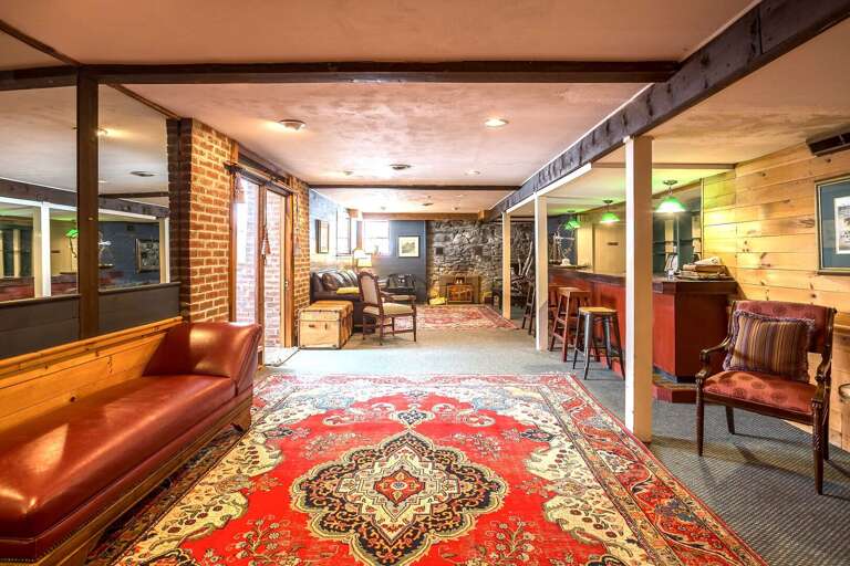 Interior Lounge Area With Furniture And Patterned Rug
