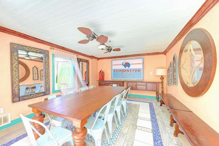 Dining, lounging, and tiki bar on garden patio, Siesta Key Village 6BR